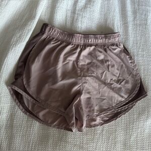 Nike Dri-FIT shorts with built in liner. Women's small in a pink/purple color.